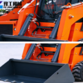 compact small skid loader side view and hydraulic cylinder closeup